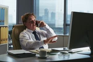 businessman receiving reference check phone call